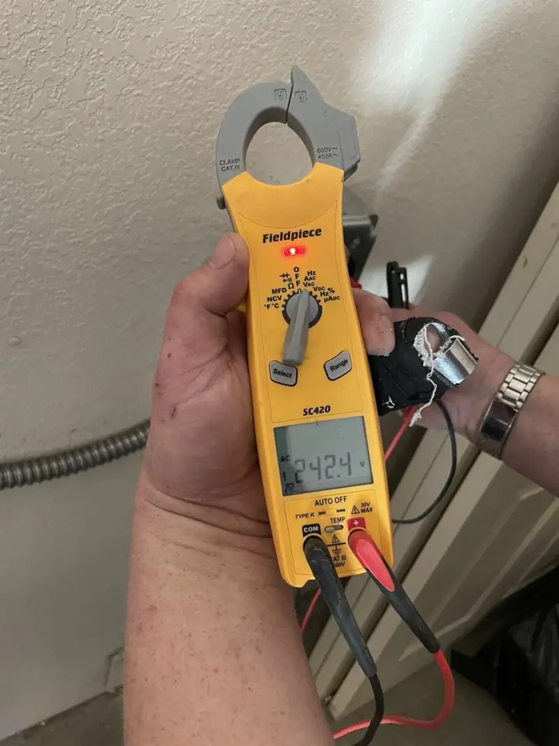 Voltage testing with clamp meter during Recessed Lighting Installation in Cottondale